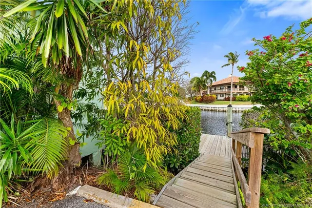 a view of balcony with wooden floor and fence