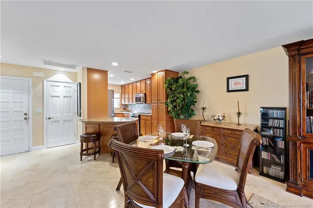 a view of a dining room with furniture and a rug