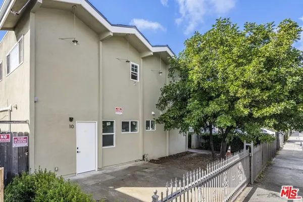 a view of a house with a tree