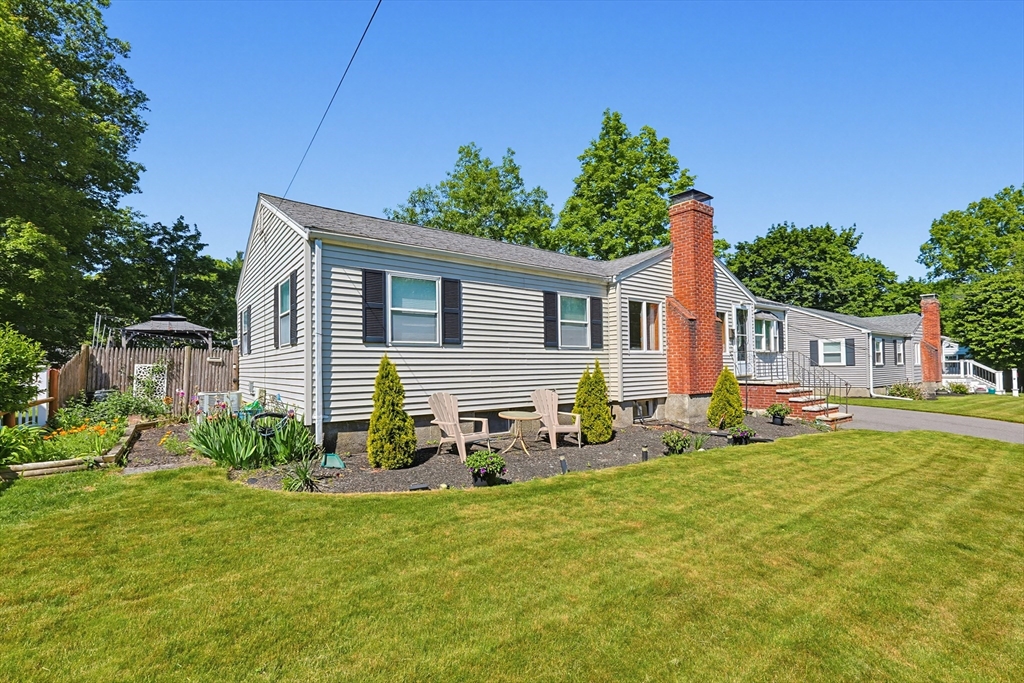 118 Spruce Road Norwood, MA 02062 - Photo 38 of 39 a backyard of a house with table and chairs