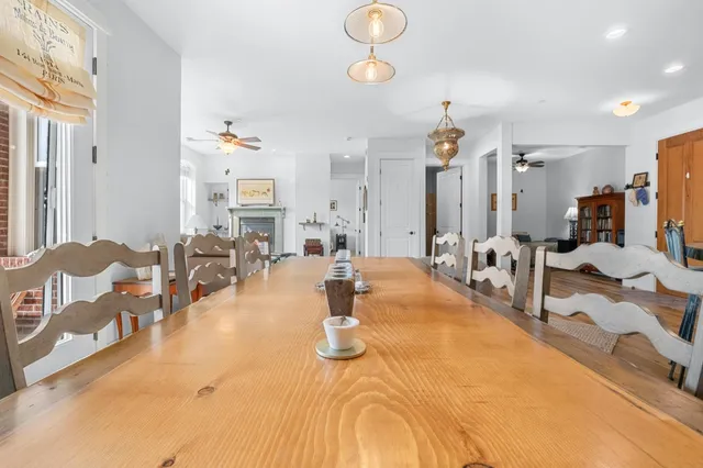a living room with dining table and chairs