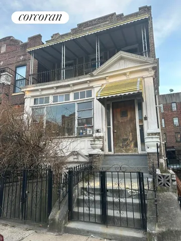 a view of a building with a entrance gate