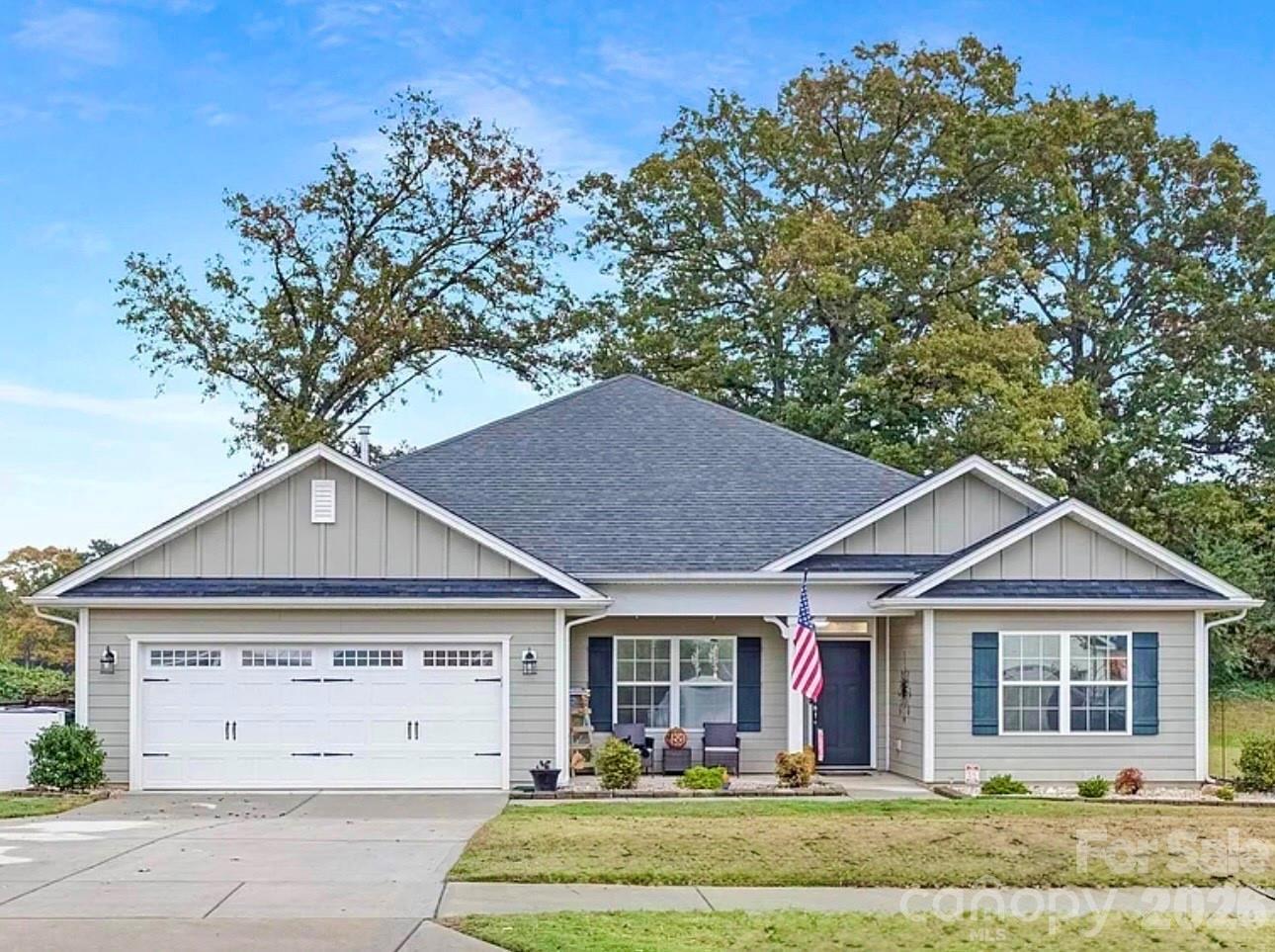 144 Sugar Hill Road Troutman, NC 28166 - Photo 1 of 18 front view of a house with a yard