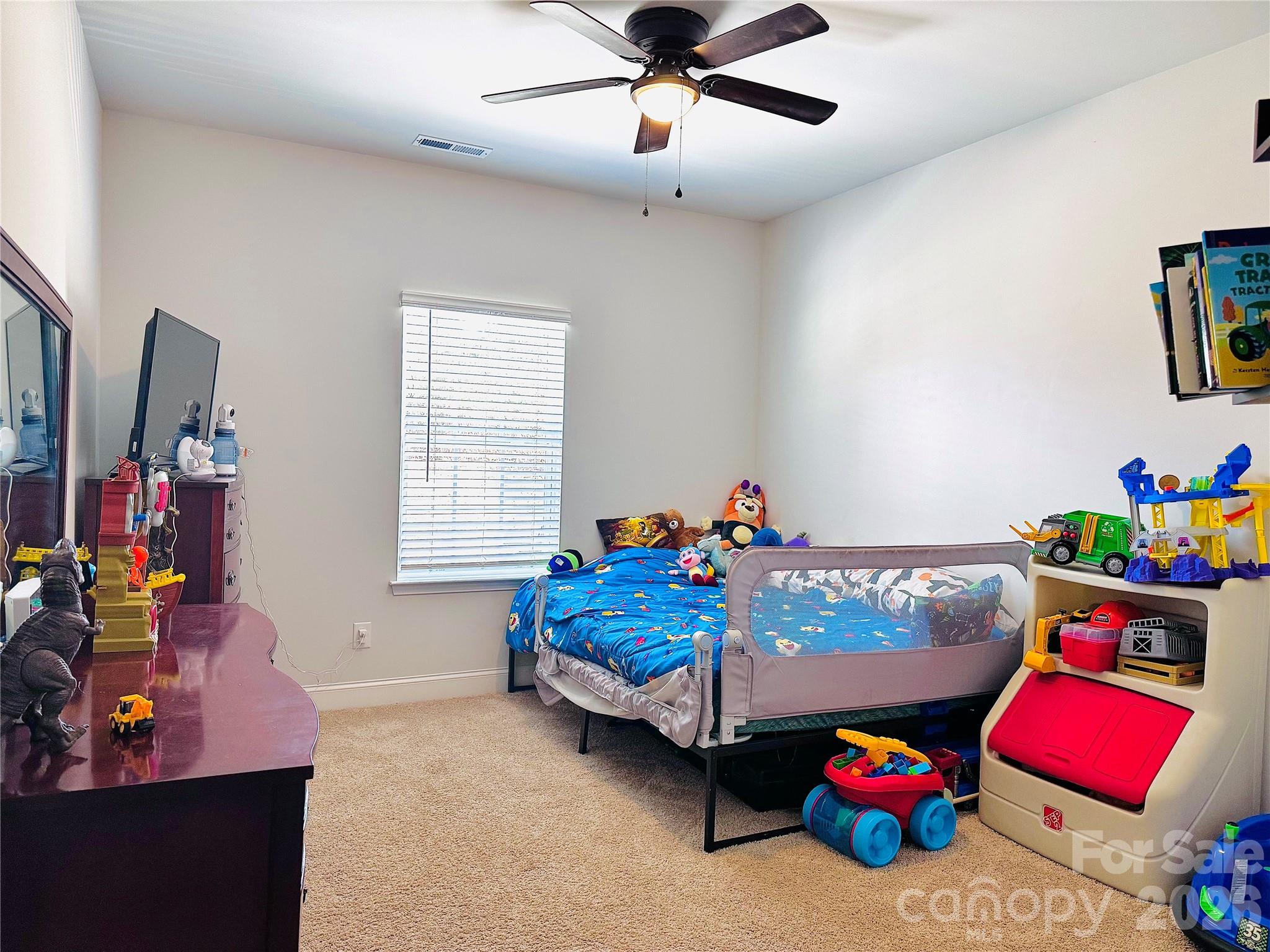 144 Sugar Hill Road Troutman, NC 28166 - Photo 11 of 18 a bedroom with furniture and a window