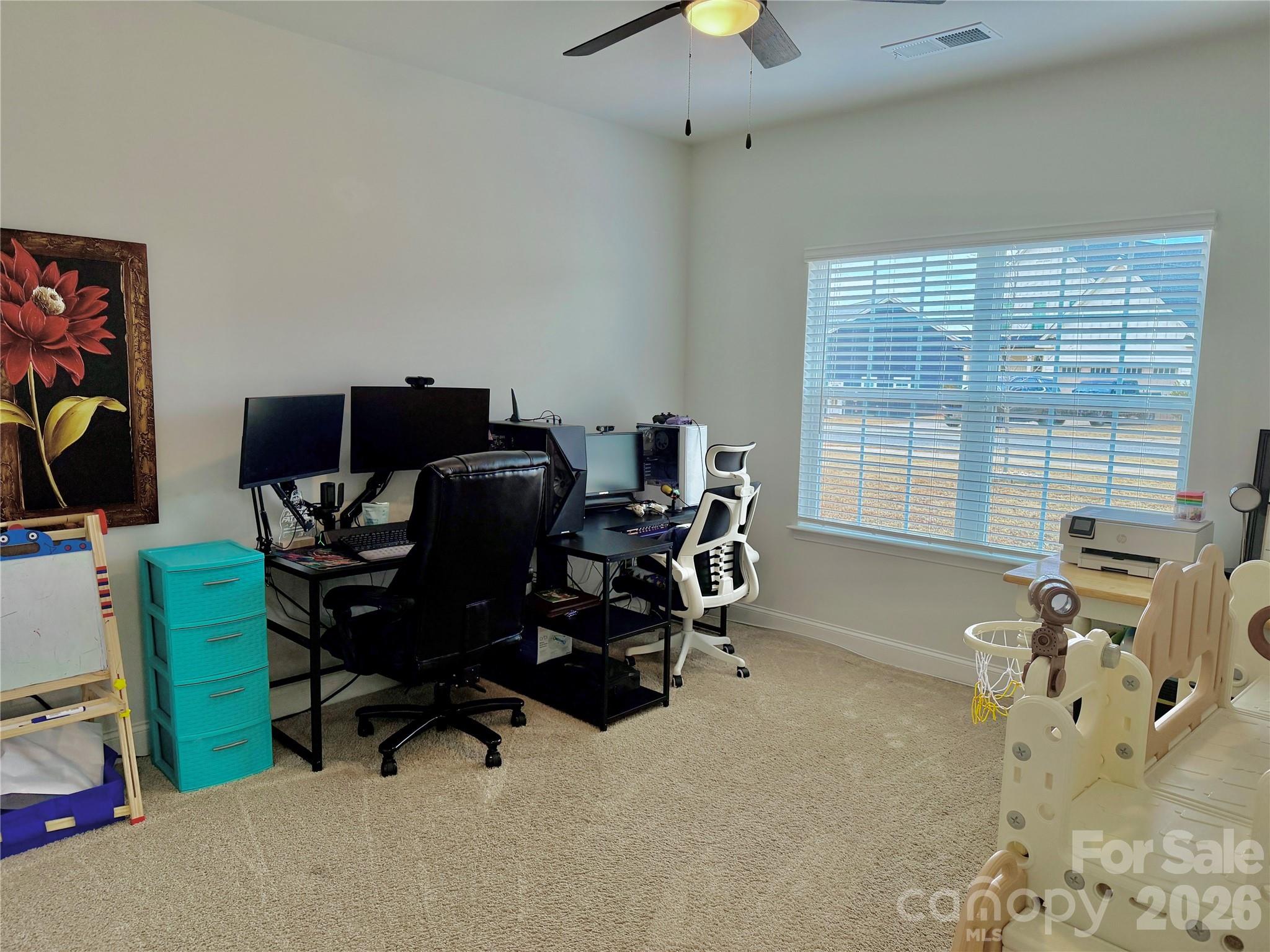 144 Sugar Hill Road Troutman, NC 28166 - Photo 14 of 18 a view of a workspace with furniture and a window