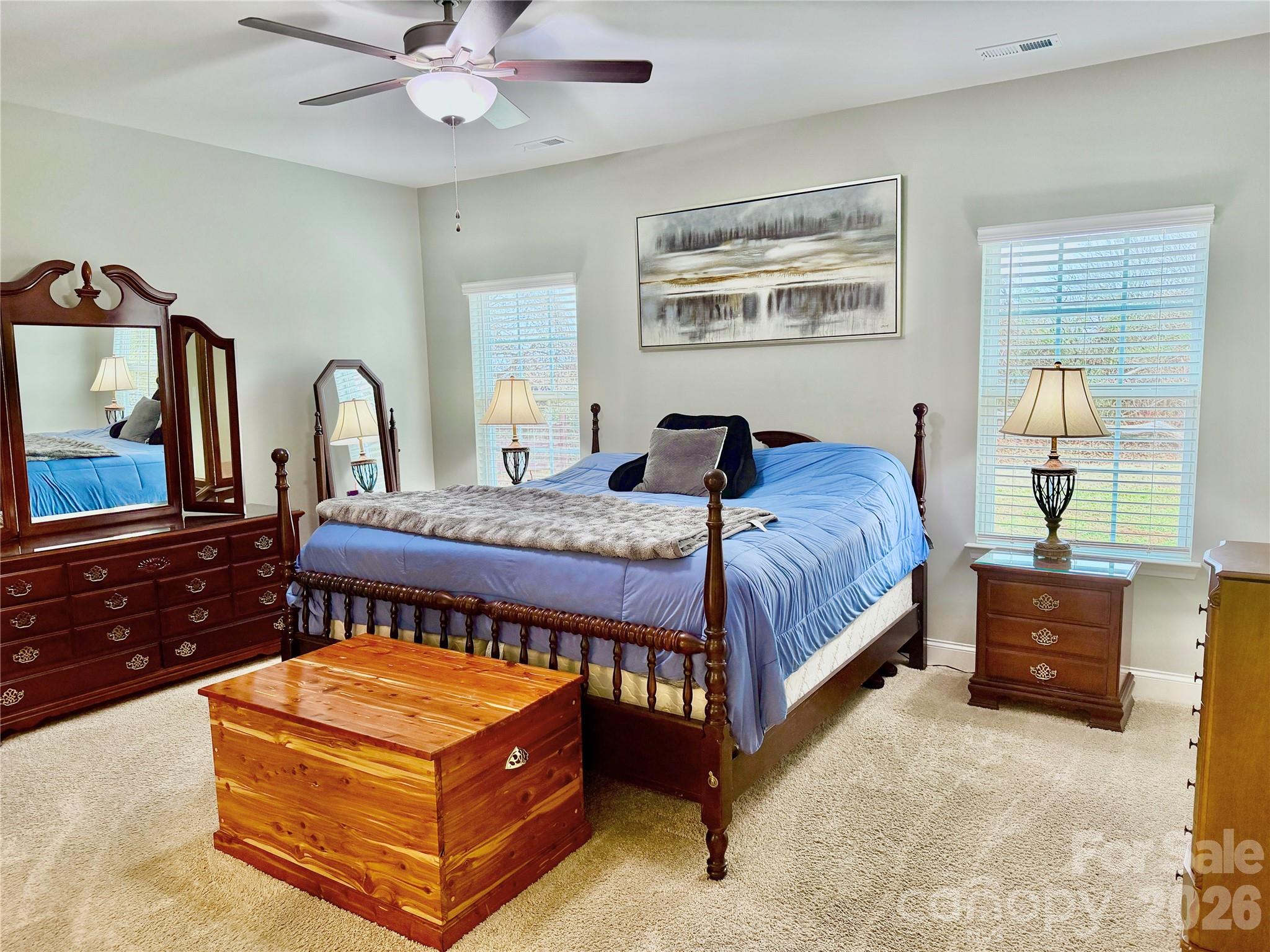144 Sugar Hill Road Troutman, NC 28166 - Photo 8 of 18 a bedroom with a bed window and dresser