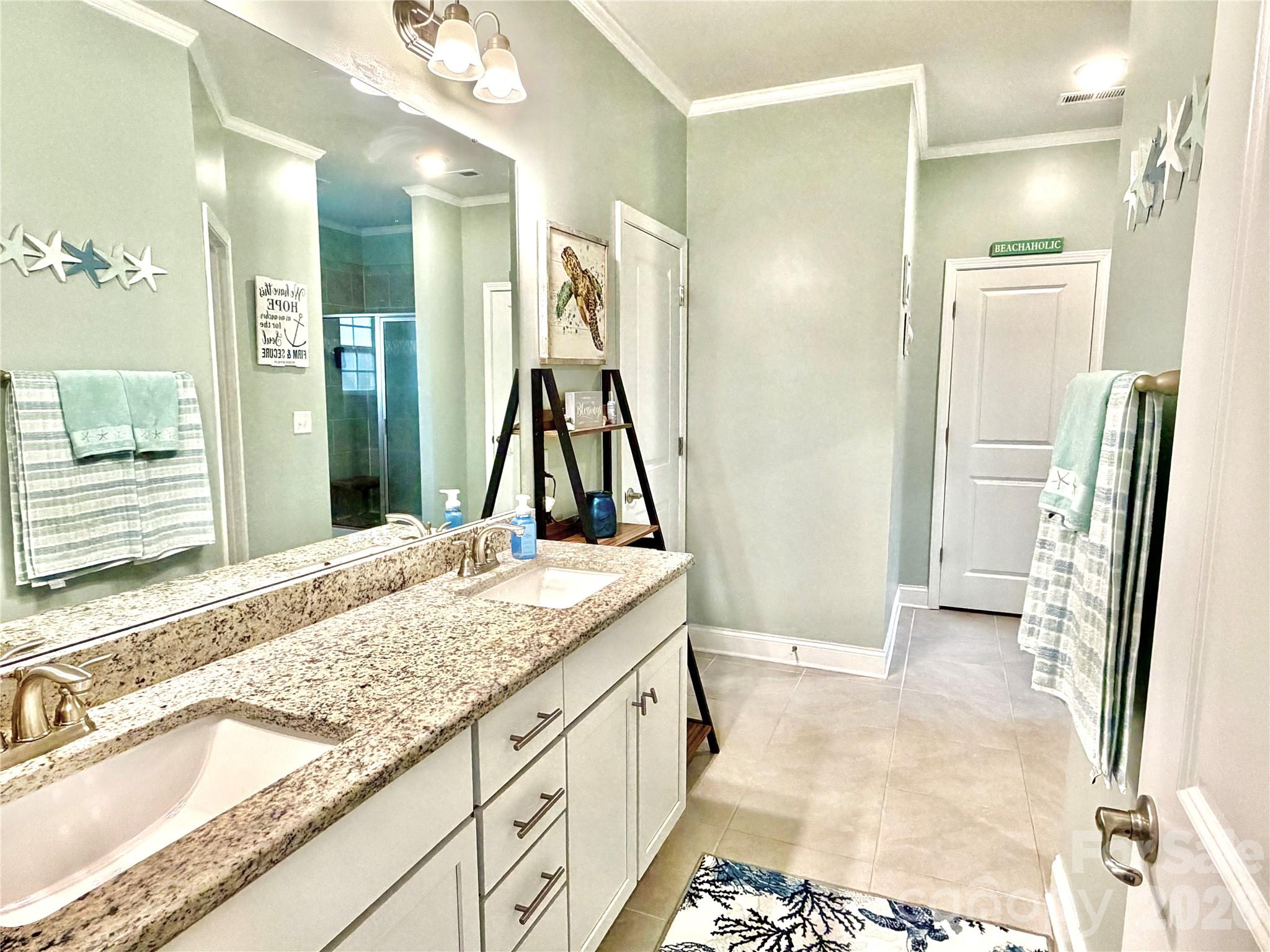 144 Sugar Hill Road Troutman, NC 28166 - Photo 9 of 18 a bathroom with a granite countertop sink and a mirror
