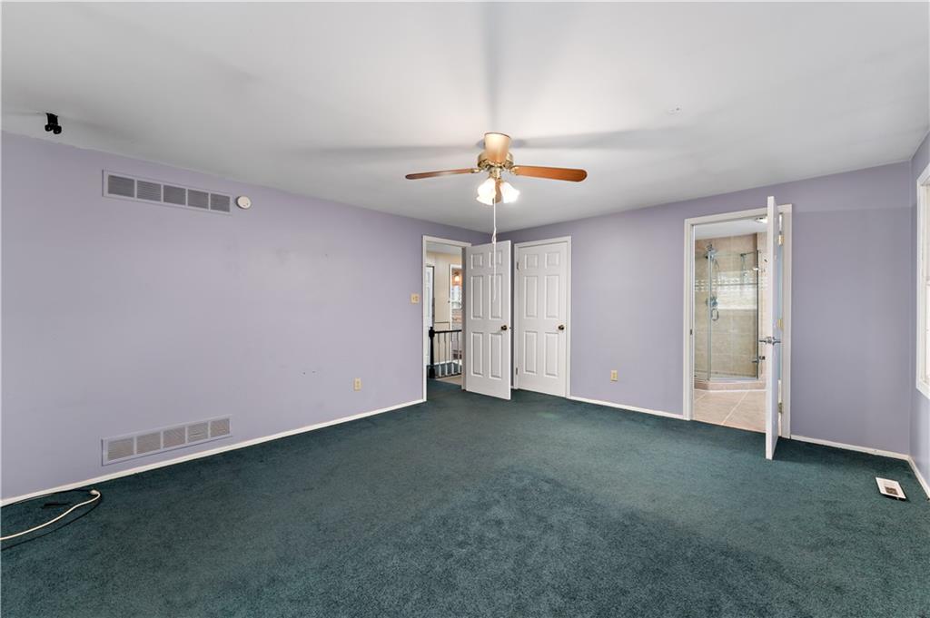 1523 Hastings Mill Road Pittsburgh, PA 15241 - Photo 19 of 50 an empty room with a ceiling fan and a window