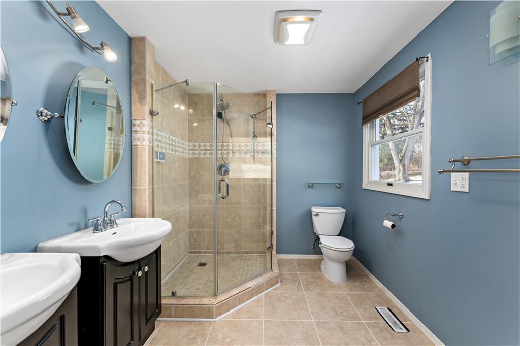 1523 Hastings Mill Road Pittsburgh, PA 15241 - Photo 21 of 50 a bathroom with a toilet sink and mirror