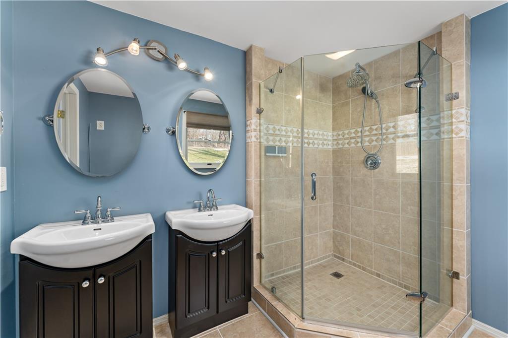1523 Hastings Mill Road Pittsburgh, PA 15241 - Photo 22 of 50 a bathroom with a double vanity sink mirror and shower