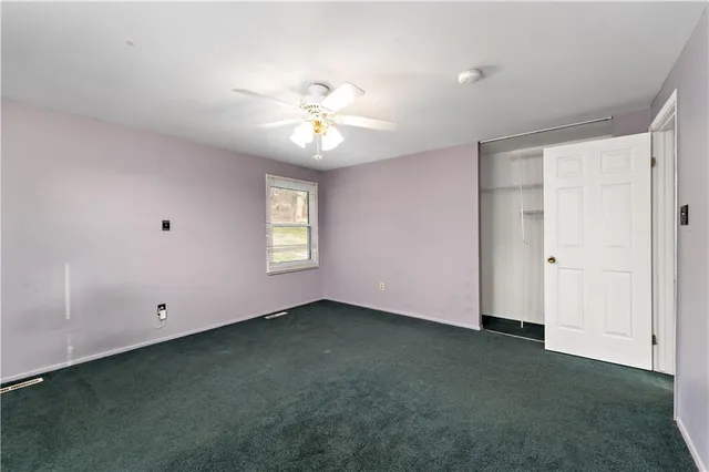 a bathroom with a toilet a sink and shower