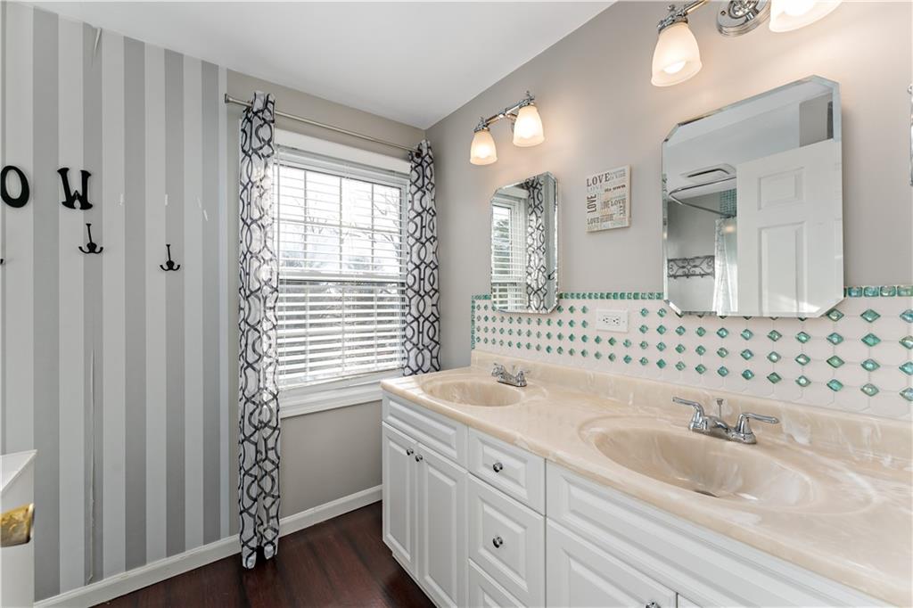 1523 Hastings Mill Road Pittsburgh, PA 15241 - Photo 29 of 50 a bathroom with a sink a toilet and a mirror