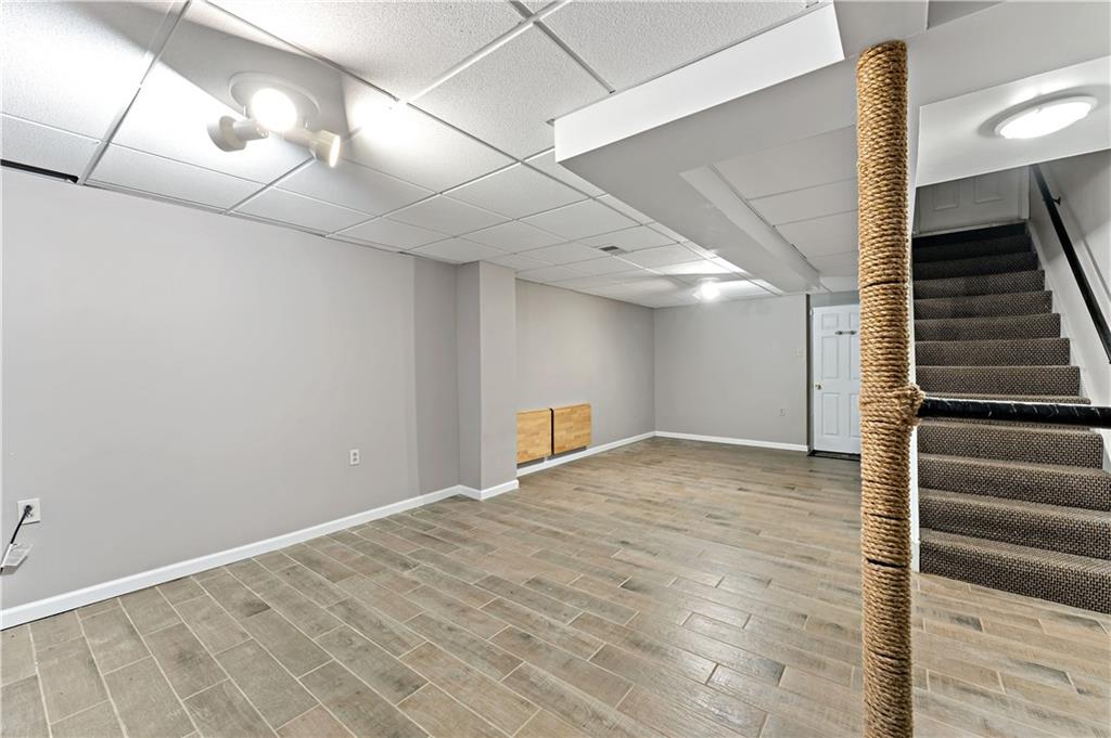 1523 Hastings Mill Road Pittsburgh, PA 15241 - Photo 34 of 50 a view of an empty room with wooden floor