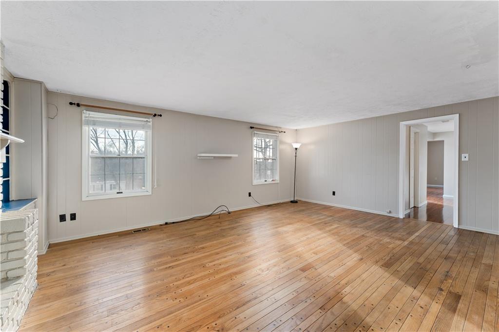 1523 Hastings Mill Road Pittsburgh, PA 15241 - Photo 4 of 50 a view of an empty room with wooden floor and a window