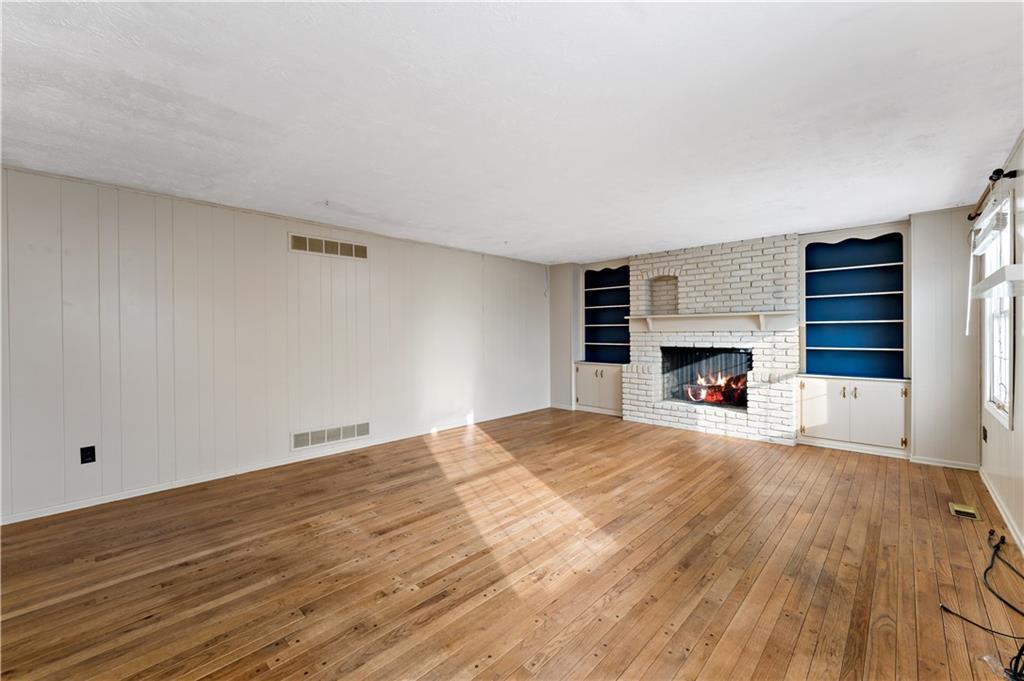 1523 Hastings Mill Road Pittsburgh, PA 15241 - Photo 5 of 50 a view of empty room with a fireplace and window