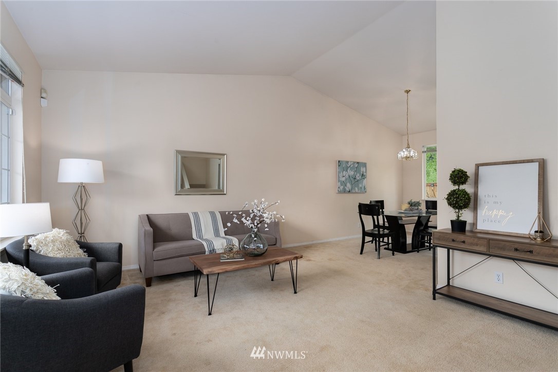 13404 Elk Ridge Road Southeast Monroe, WA 98272 - Photo 5 of 30 a living room with furniture and a potted plant