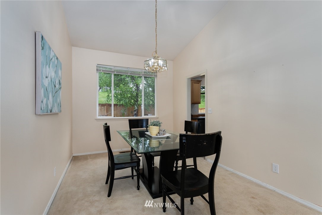 13404 Elk Ridge Road Southeast Monroe, WA 98272 - Photo 7 of 30 a dining room with furniture and window