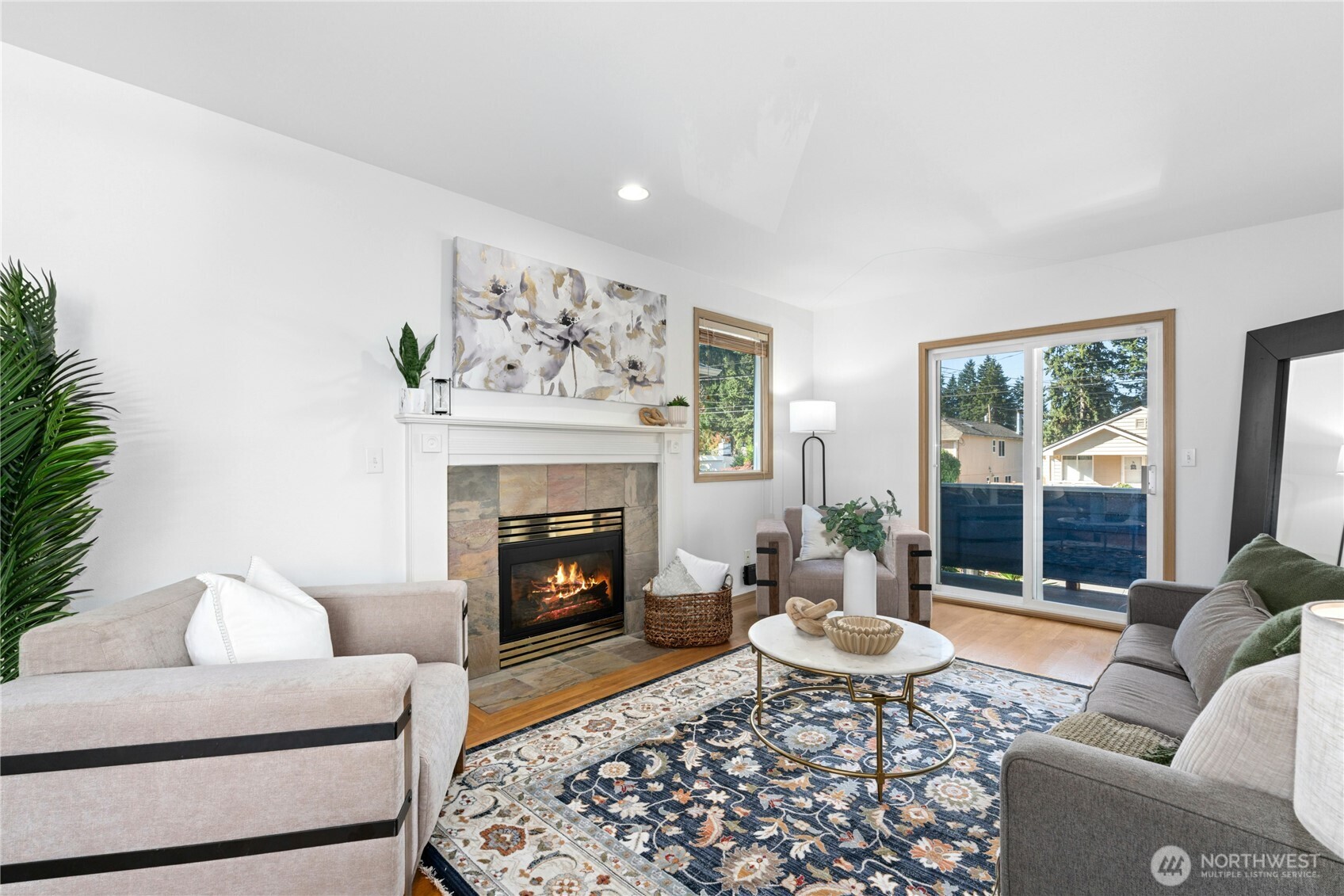 a living room with furniture and a fireplace