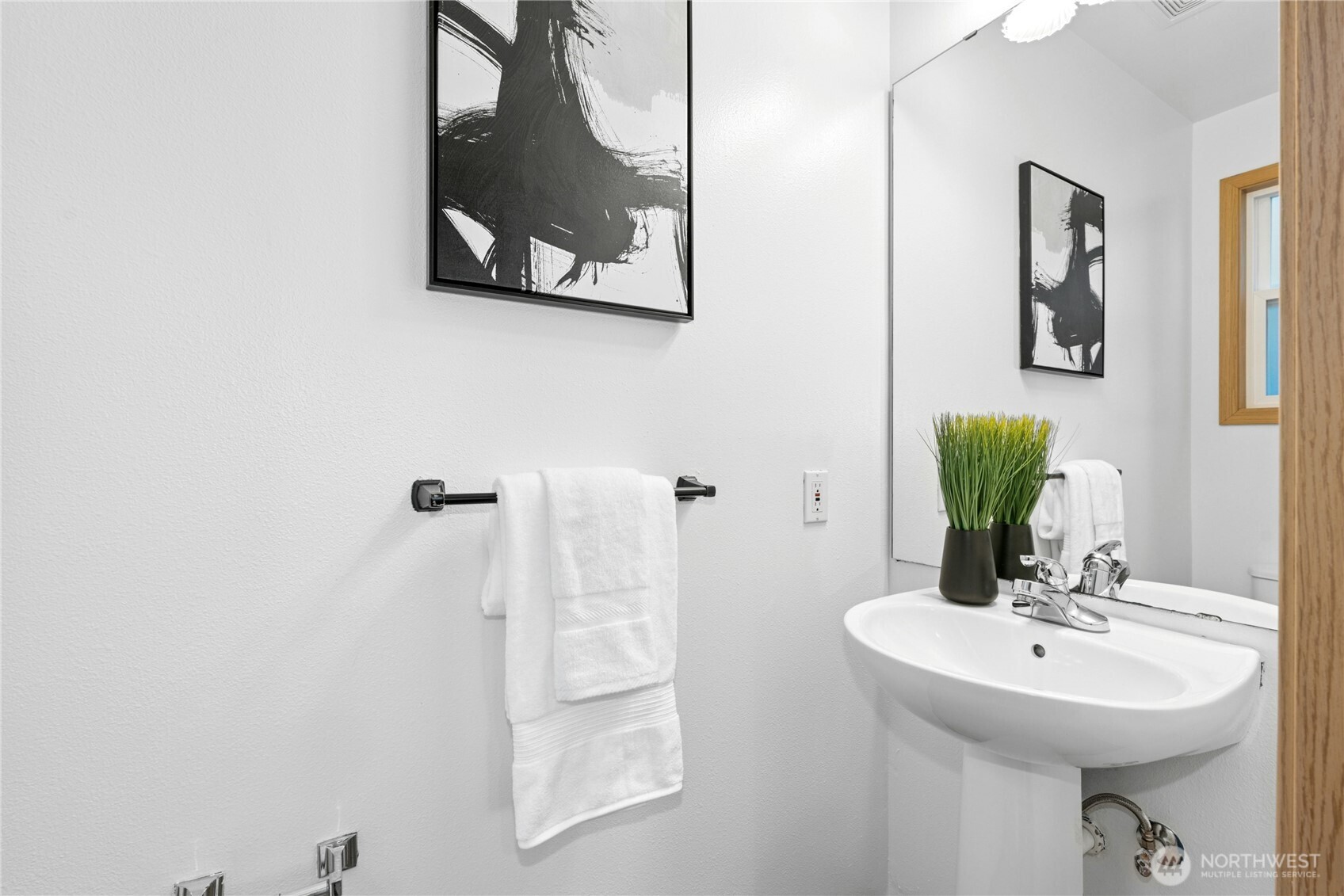 14348 Wallingford Avenue North Seattle, WA 98133 - Photo 12 of 28 a bathroom with a sink and a mirror