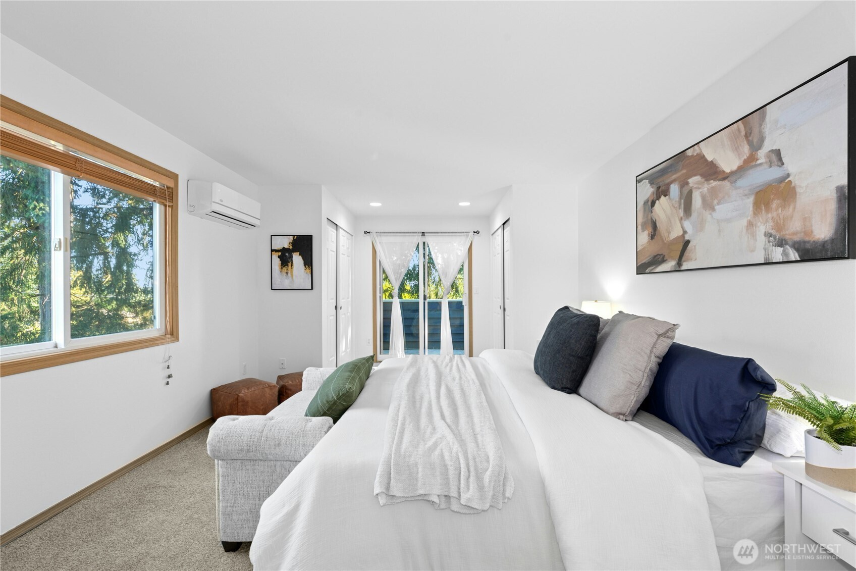 14348 Wallingford Avenue North Seattle, WA 98133 - Photo 13 of 28 a bedroom with a large bed and a window