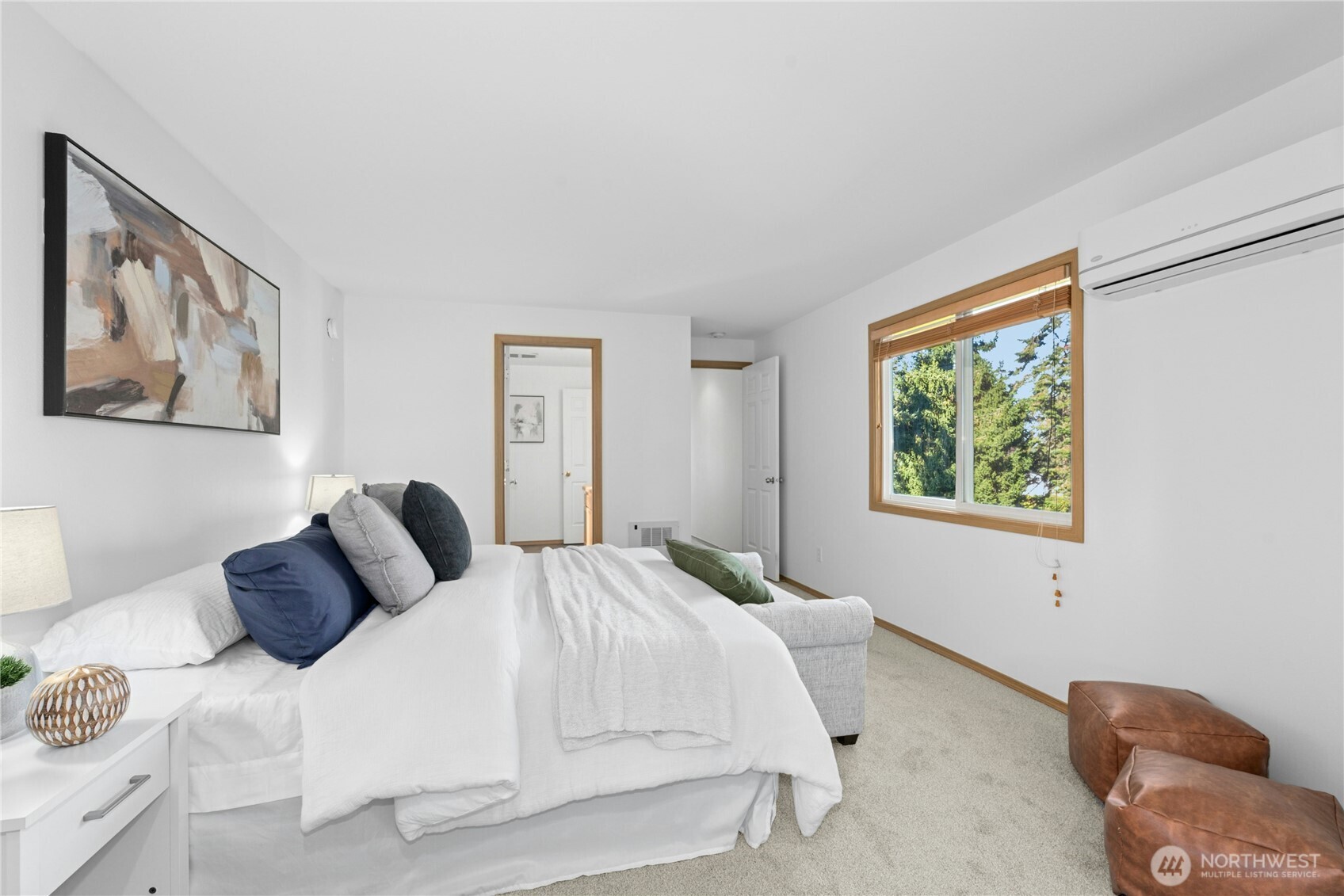 14348 Wallingford Avenue North Seattle, WA 98133 - Photo 14 of 28 a bedroom with a bed and a painting on the wall