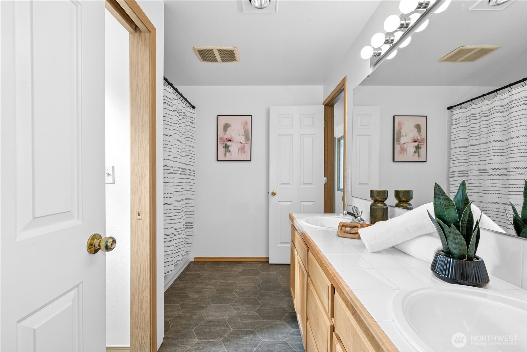 14348 Wallingford Avenue North Seattle, WA 98133 - Photo 18 of 28 a kitchen with a sink and a refrigerator