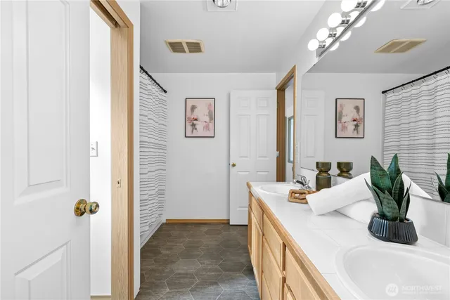 a kitchen with a sink and a refrigerator