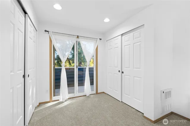 a view of an empty room with a sliding door