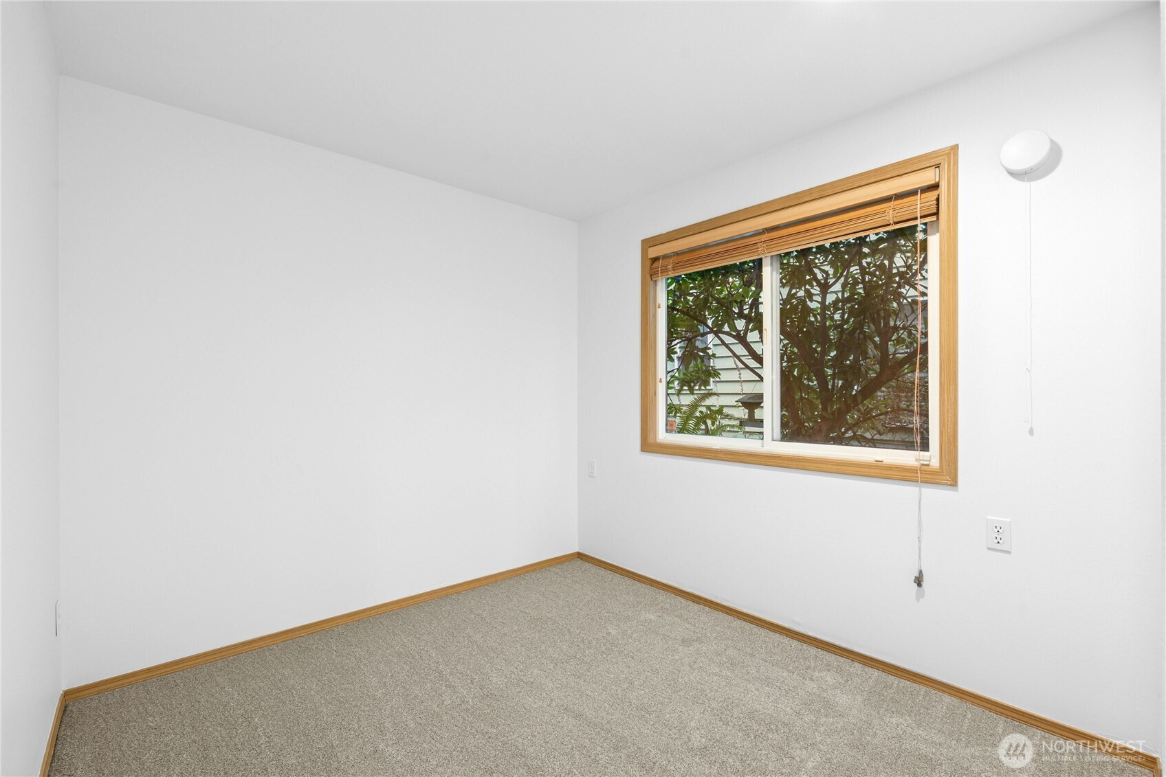 14348 Wallingford Avenue North Seattle, WA 98133 - Photo 23 of 28 an empty room with a window