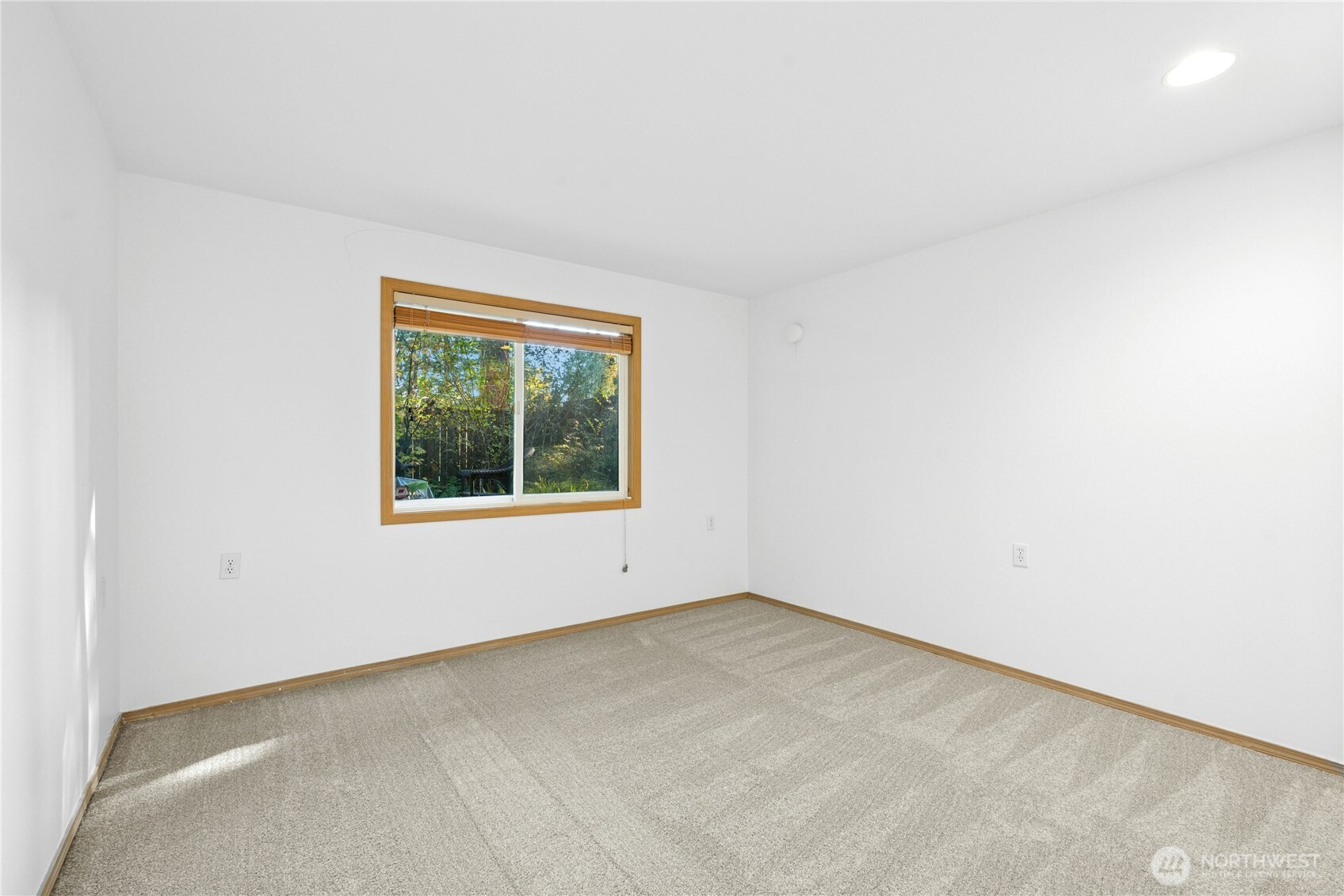 14348 Wallingford Avenue North Seattle, WA 98133 - Photo 24 of 28 an empty room with a window