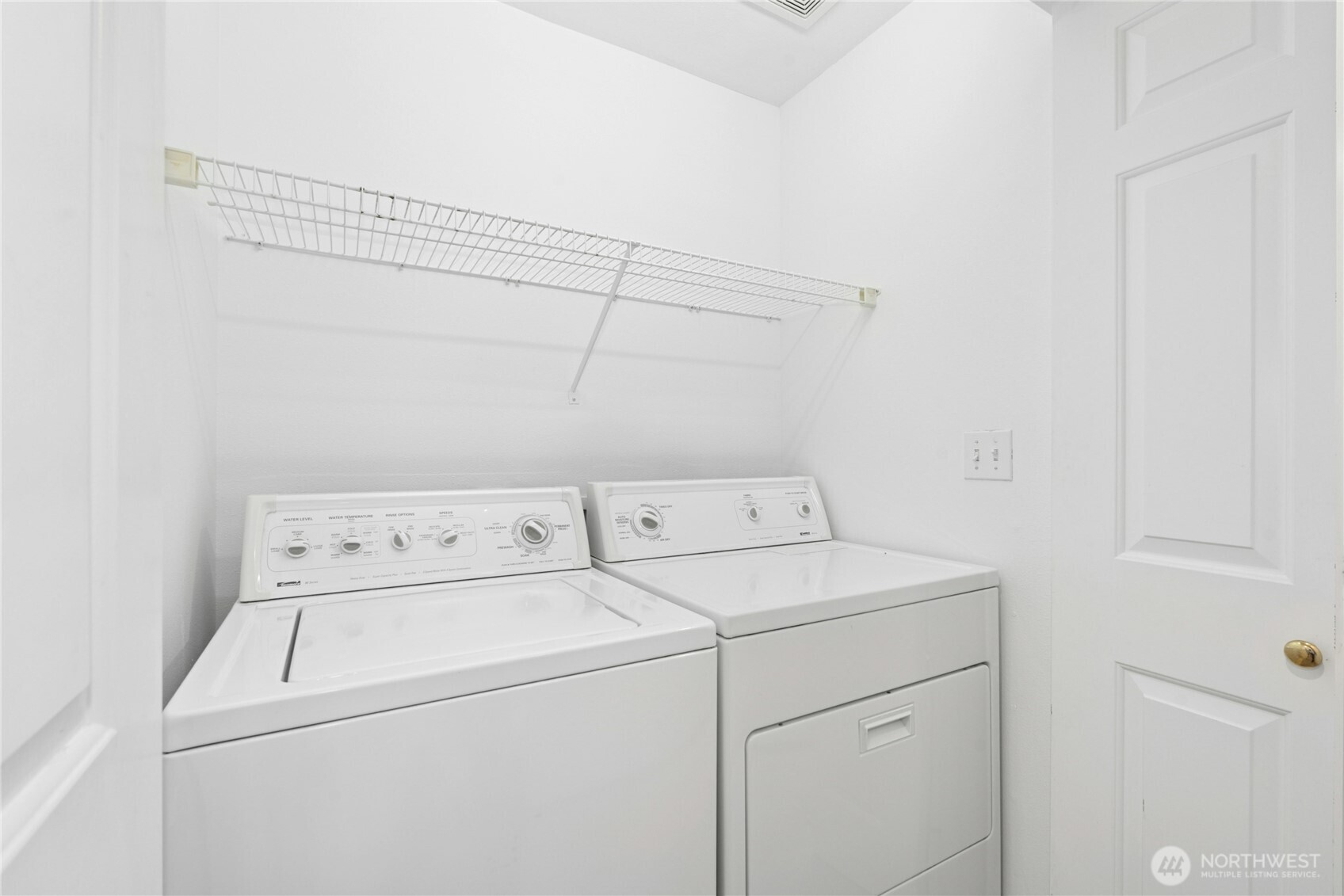 14348 Wallingford Avenue North Seattle, WA 98133 - Photo 25 of 28 a utility room with dryer and washer