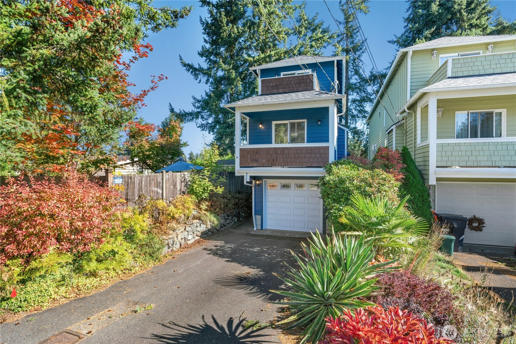 14348 Wallingford Avenue North Seattle, WA 98133 - Photo 4 of 28 a house that has a tree in front of it