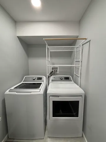 a utility room with dryer and washer