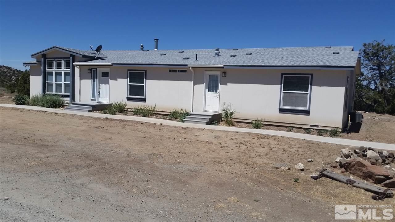 6600 Quaking Aspen Road Reno, NV 89510 - Photo 1 of 1 a front view of a house with a yard