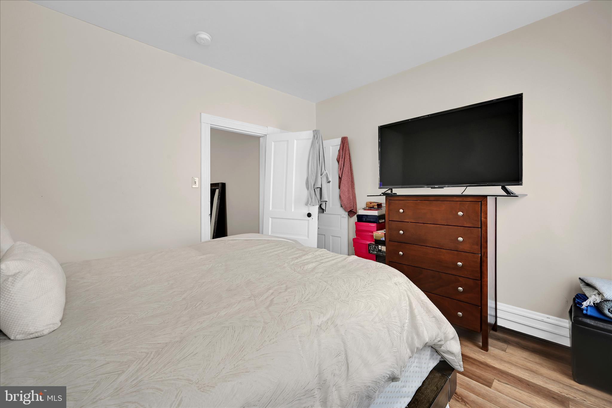 942 Pike Street Reading, PA 19604 - Photo 18 of 27 a bedroom with a bed and a flat screen tv