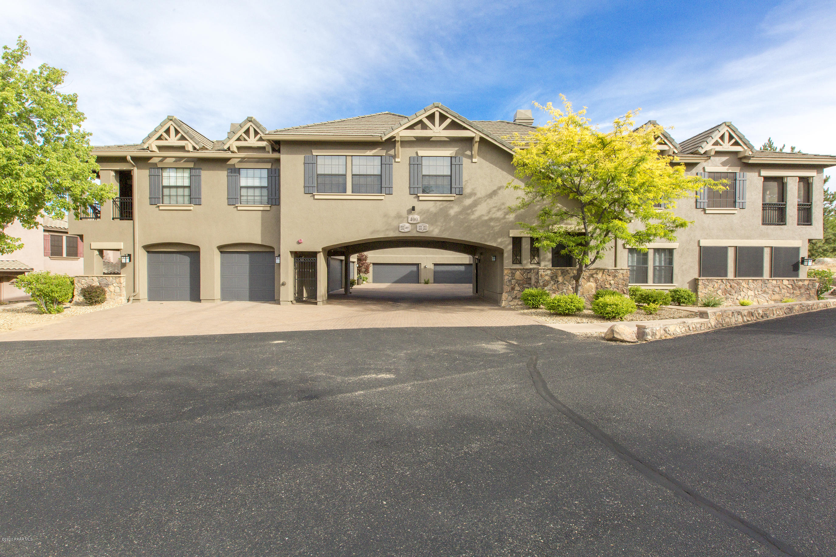 a front view of a building with a street