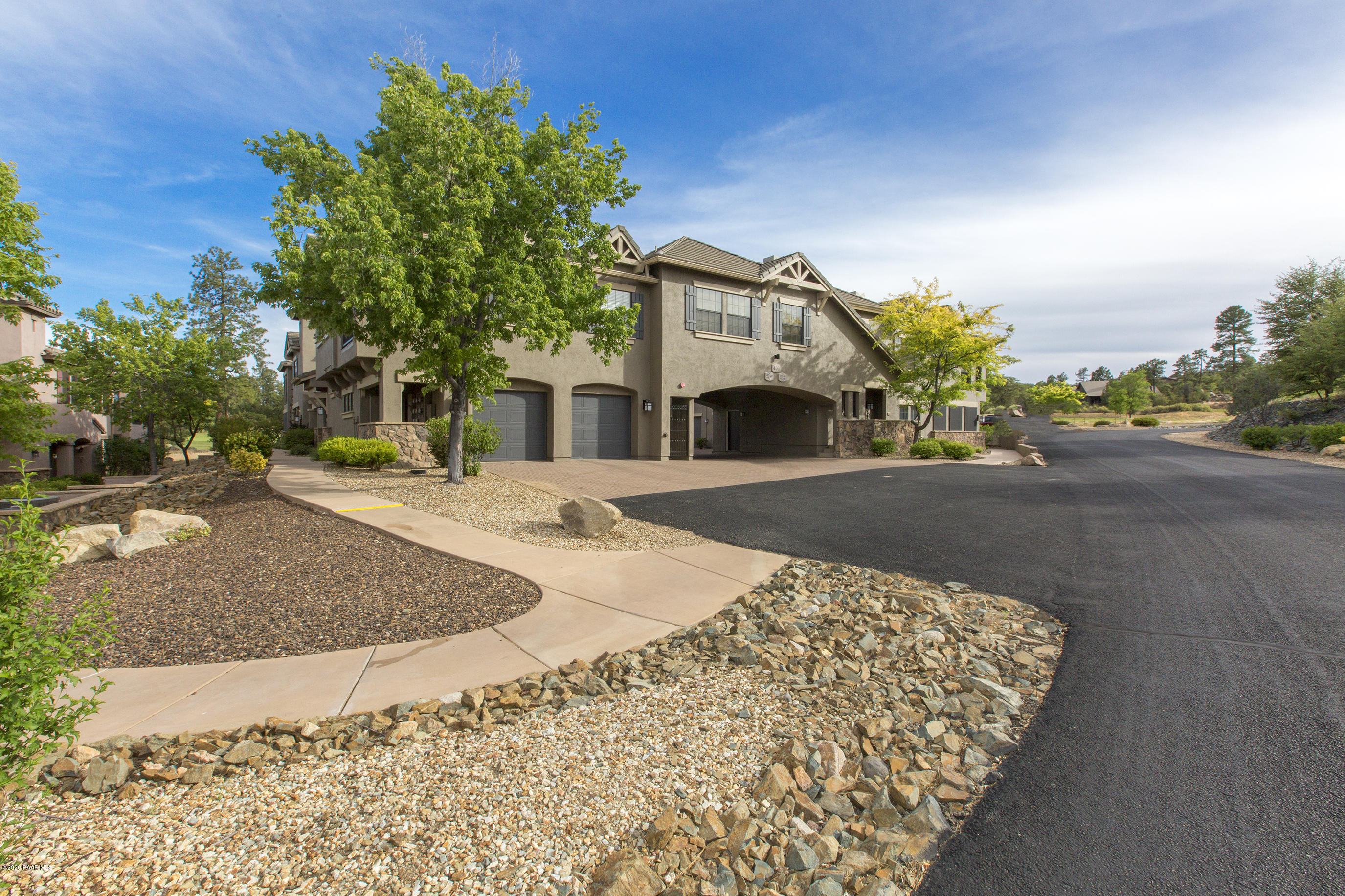 1716 Alpine Meadows Lane, Unit 403 Prescott, AZ 86303 - Photo 2 of 39 a view of a house with a patio