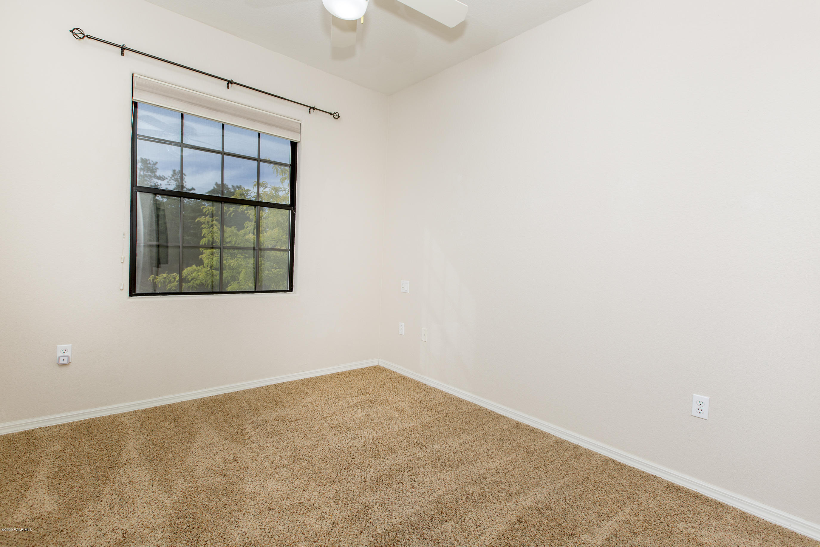 1716 Alpine Meadows Lane, Unit 403 Prescott, AZ 86303 - Photo 26 of 39 an empty room with a window
