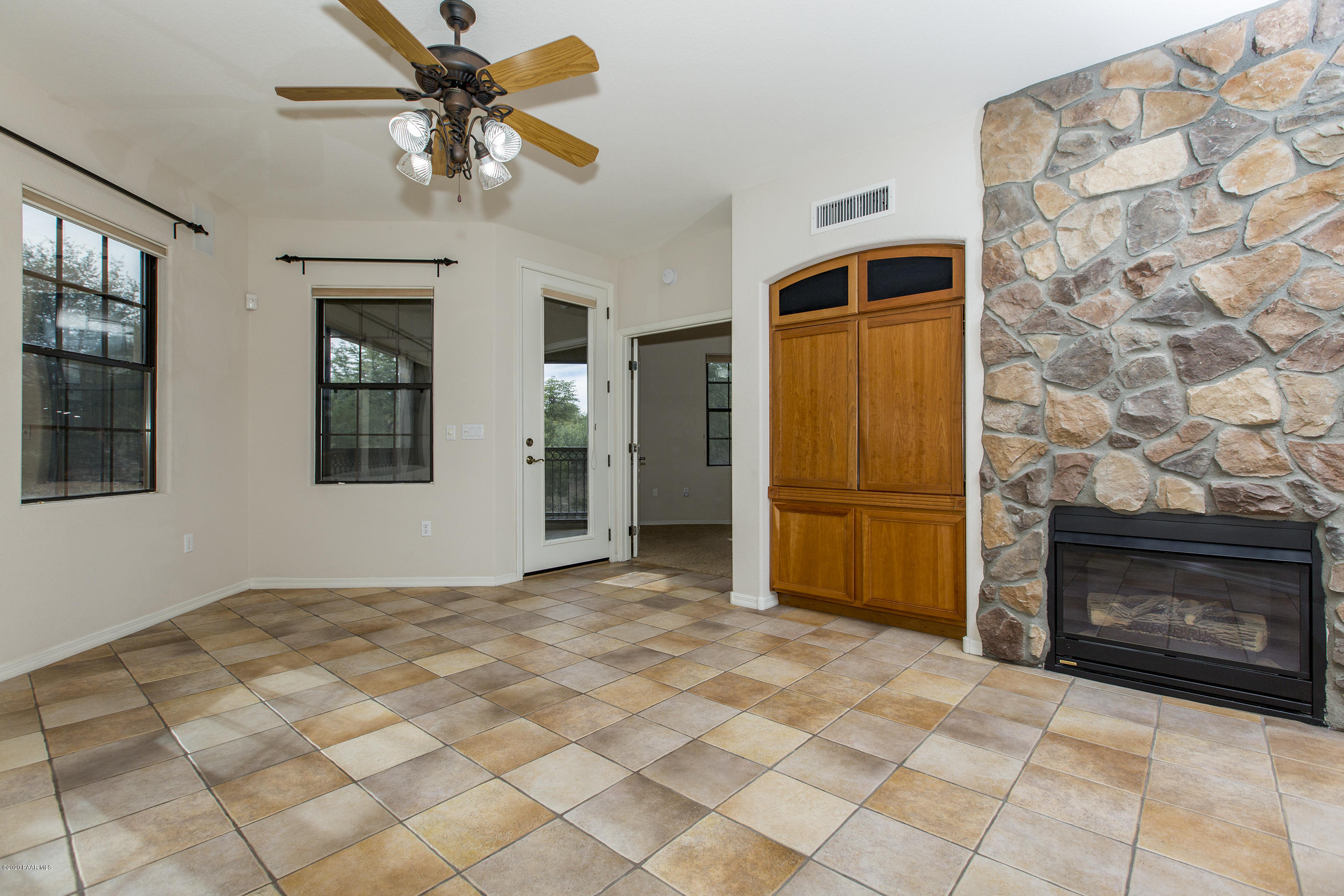1716 Alpine Meadows Lane, Unit 403 Prescott, AZ 86303 - Photo 5 of 39 a view of empty room with windows and fireplace