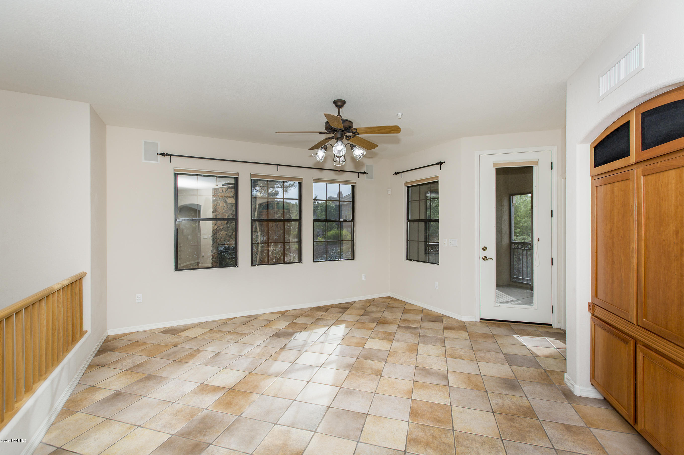 1716 Alpine Meadows Lane, Unit 403 Prescott, AZ 86303 - Photo 7 of 39 a view of an empty room with a window