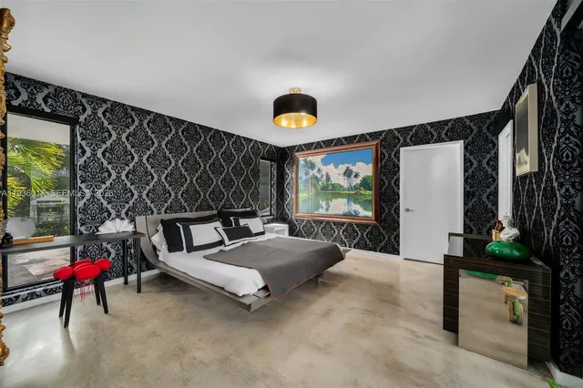 an aerial view of residential houses with outdoor space and river