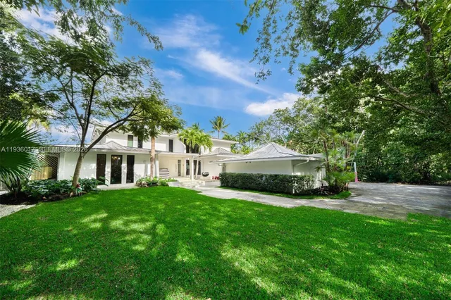 a living room with furniture and flat screen tv