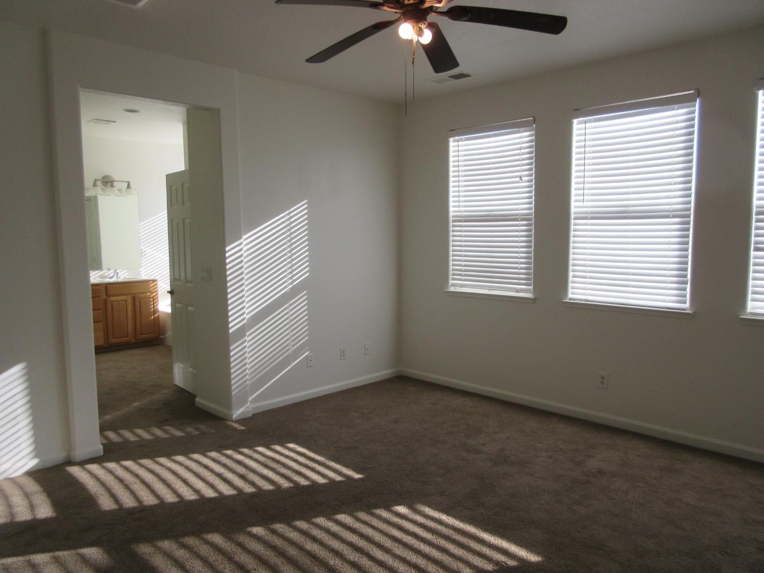 1016 Papaya Street Madera, CA 93638 - Photo 19 of 29 a view of an empty room with a window