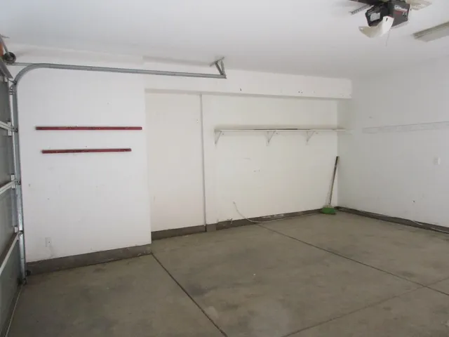 a view of a balcony with wooden fence
