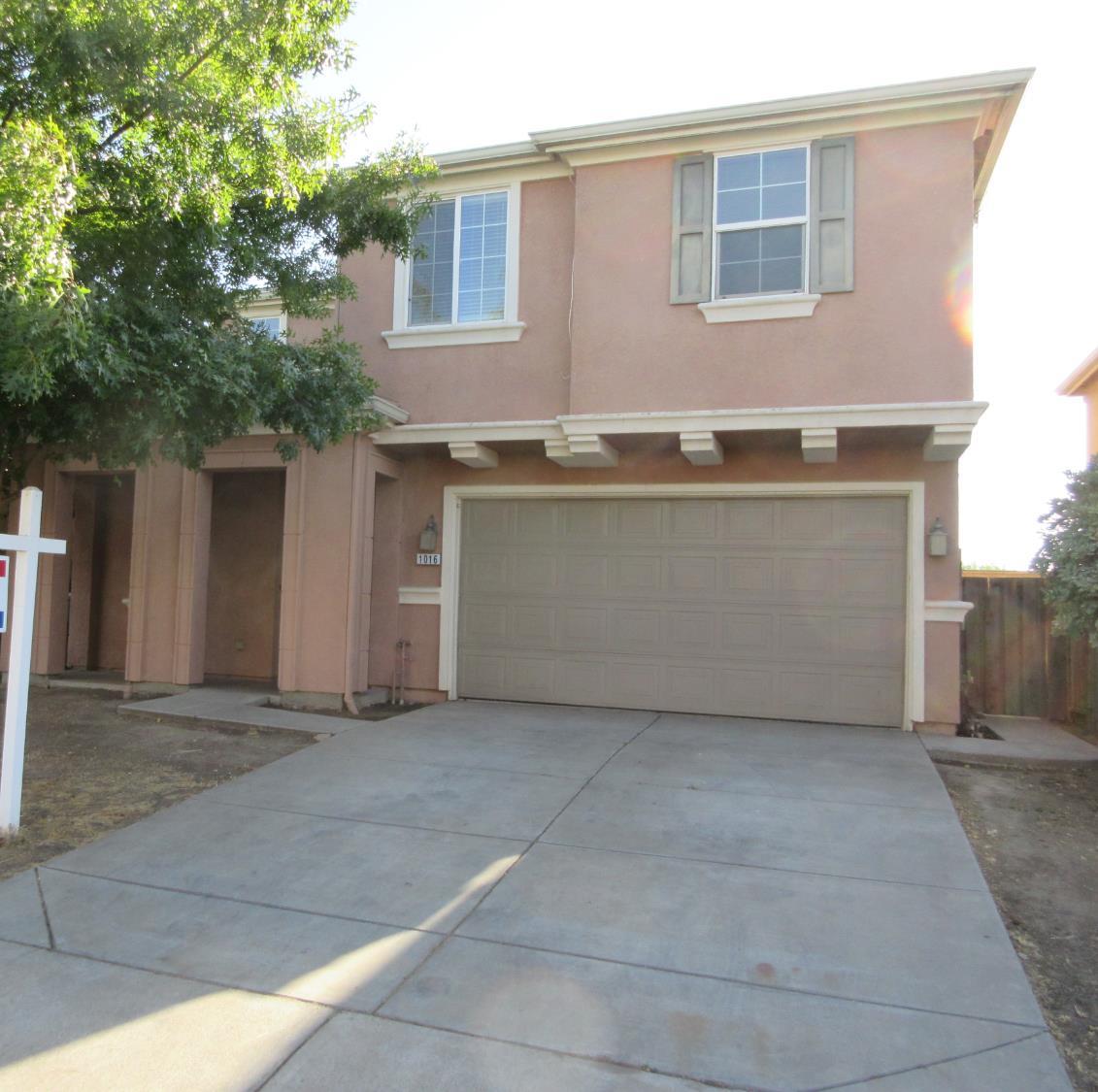 1016 Papaya Street Madera, CA 93638 - Photo 3 of 29 a view of house with outdoor space