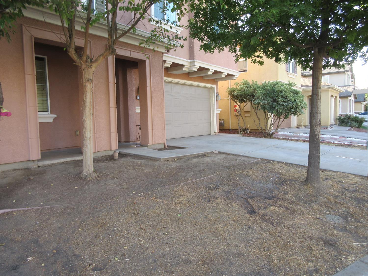 1016 Papaya Street Madera, CA 93638 - Photo 4 of 29 front view of a house with a tree