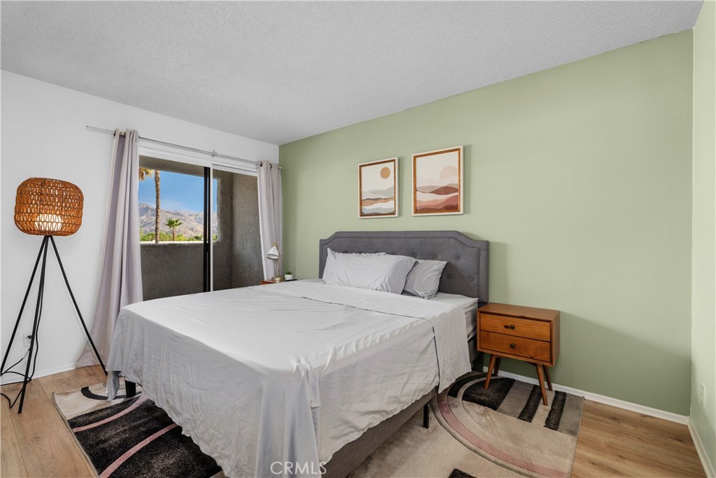 69646 Antonia Way Rancho Mirage, CA 92270 - Photo 37 of 50 a bed room with a bed and a chair