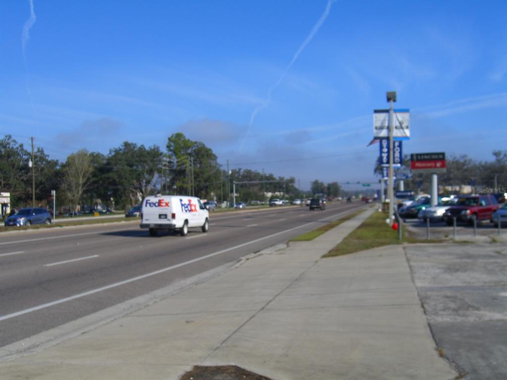 7154 Broad Street Brooksville, FL 34601 - Photo 2 of 8 a view of a city street from a building