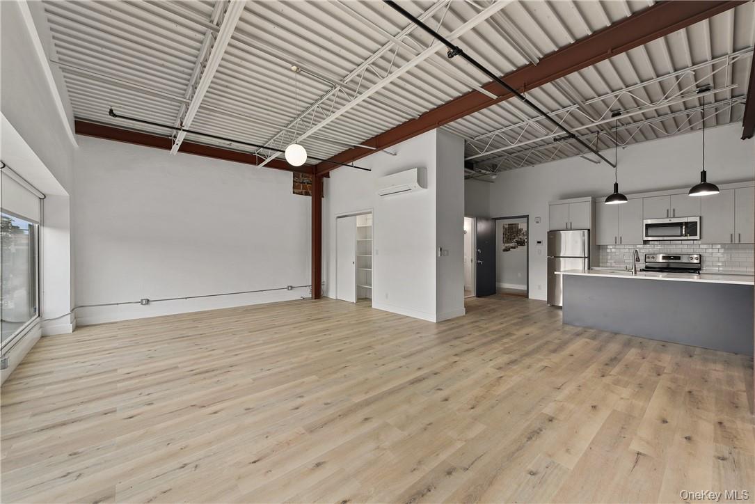 189 North Main Street, Unit 2 Port Chester, NY 10573 - Photo 5 of 13 a view of empty room with wooden floor