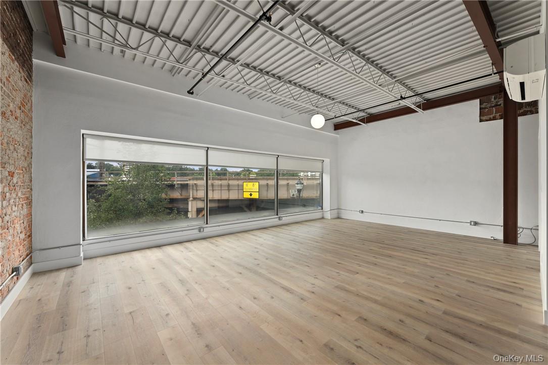 189 North Main Street, Unit 2 Port Chester, NY 10573 - Photo 6 of 13 a view of empty room with wooden floor